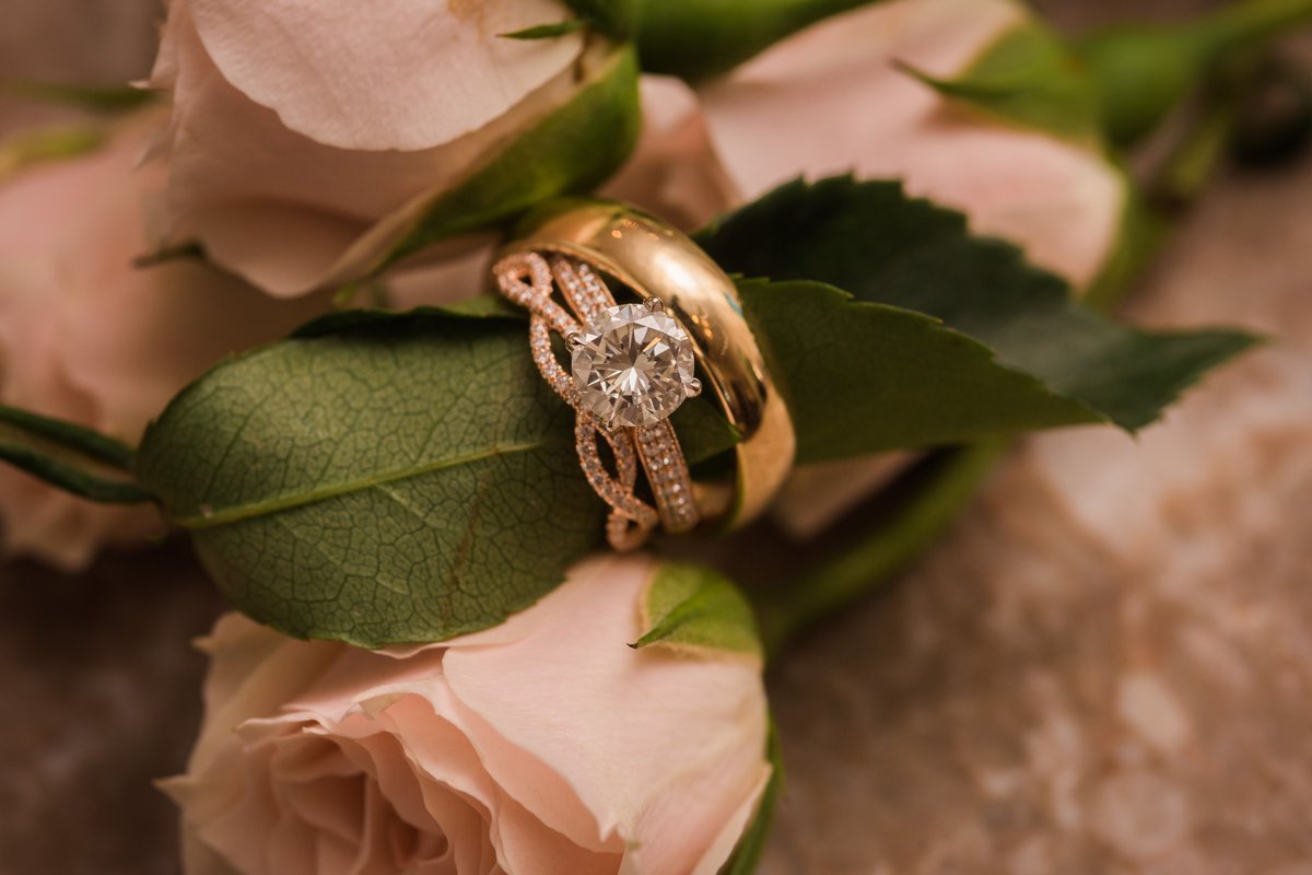 Gorgeous Rose Gold Rings with Blush Flowers at Chic Butlers Courtyard Wedding